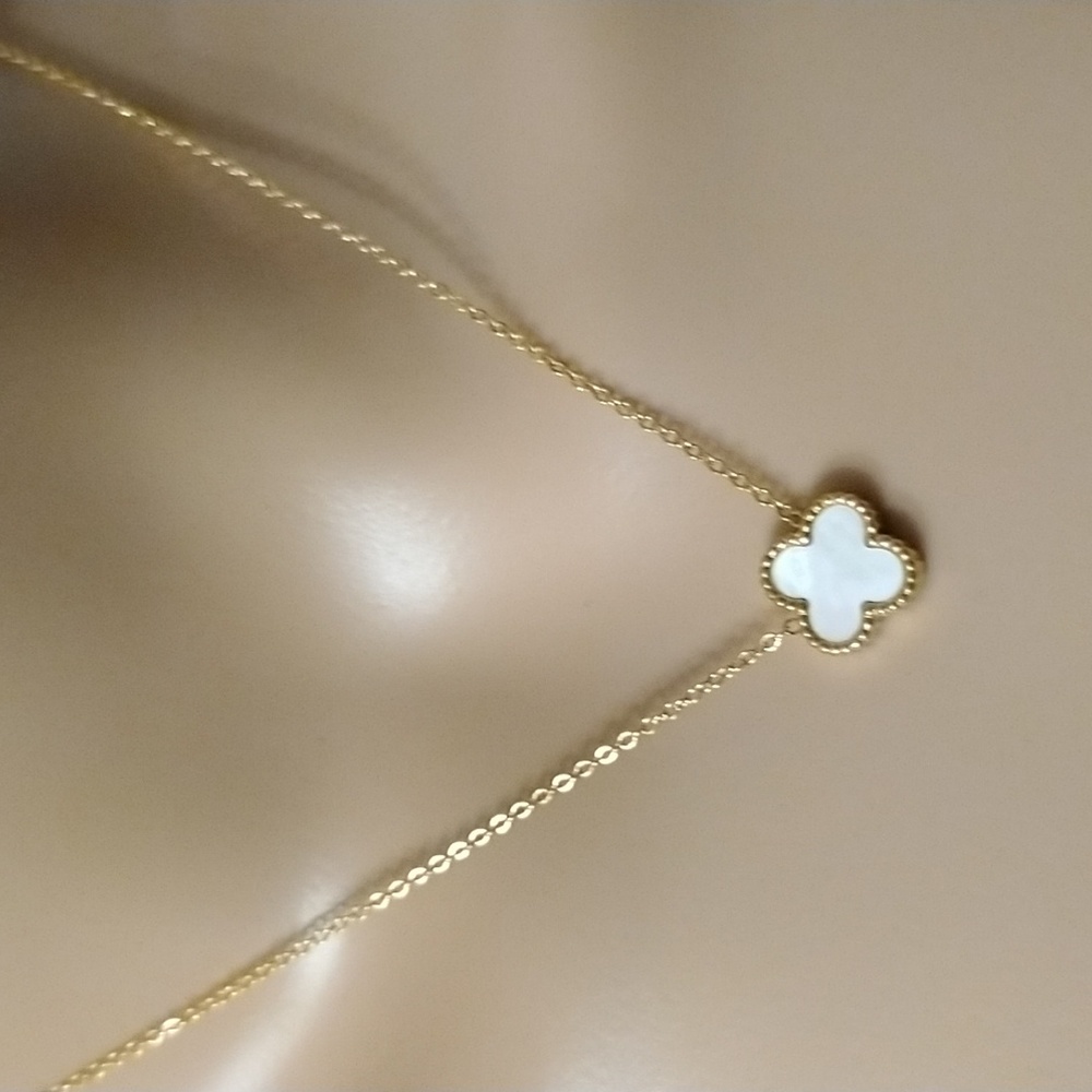 Beautiful white clover necklace with a golden stainless steel chain